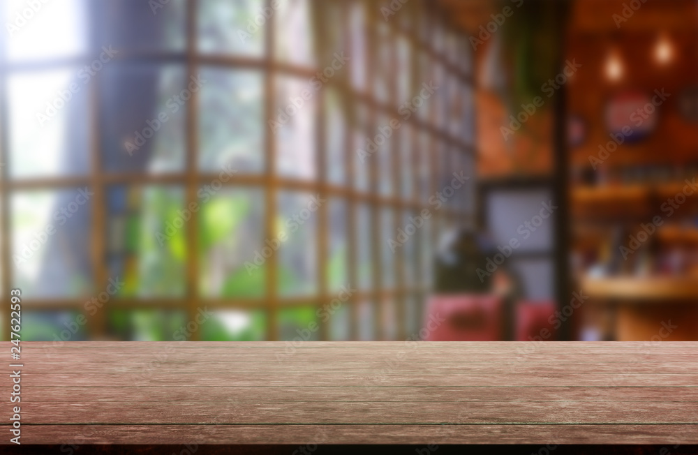 Empty wooden table in front of abstract blurred background of restaurant, cafe and coffee shop interior. can be used for display or montage your products - Image. Empty wooden table in front of abstract blurred background of restaurant, cafe and coffee shop interior. can be used for display or montage your products - Image.