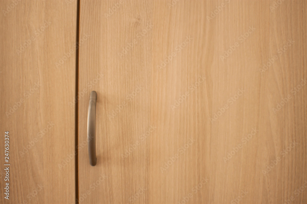 Handle on wooden background Handle on wooden background