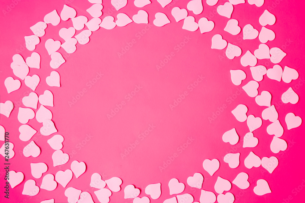 Beautiful pink background with small hearts, text frame, copy space