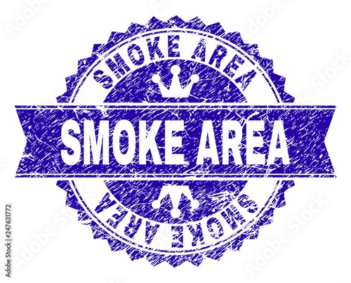 SMOKE AREA rosette stamp watermark with distress style. Designed with round rosette, ribbon and small crowns. Blue vector rubber watermark of SMOKE AREA title with dust style.