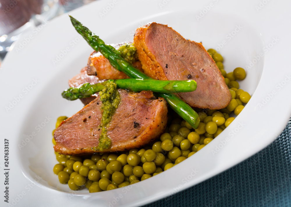 Duck breast with green pea and asparagus