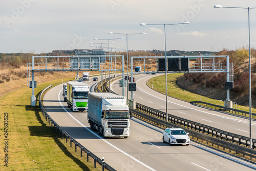 Lorry and car passing toll gate on Prague Circuit, Prague, Czech republic