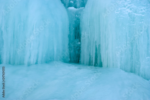 background - frozen waterfall with icicles © Evgeny