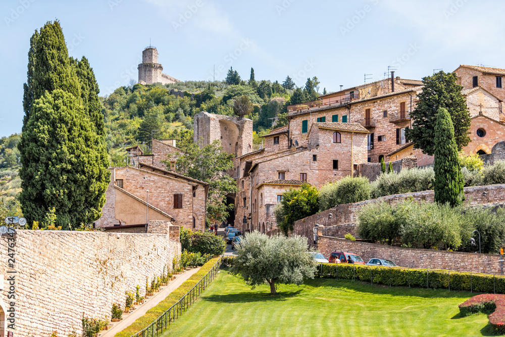Assisi, Italy Giardini di San Francesco or Gardens of Saint Francis near Basilica with green grass lawn and ancient old medieval buildings in summer