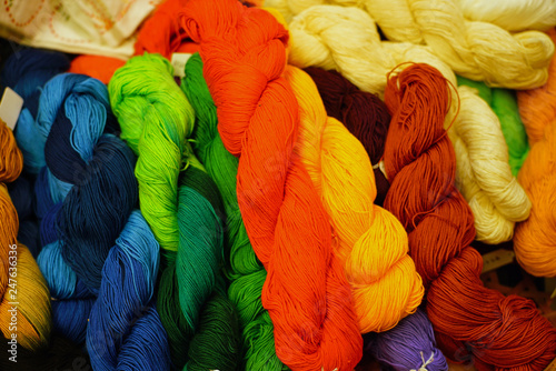 Basket of spools of colorful yarn