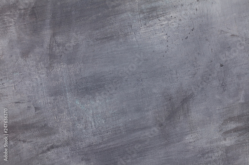 Canvas coated with aqua blue and grey acrylic paint with texture strokes. Abstract textural background. 