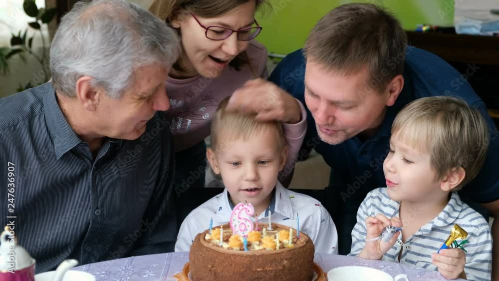 Multi Generation Family Celebrating Son's Birthday Multi Generation Family Celebrating Son's Birthday
