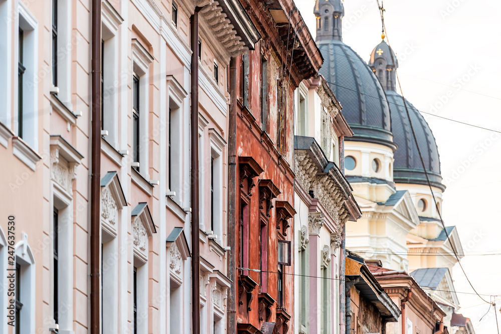 Lviv, Ukraine Streetscape side wall pattern in historic Ukrainian Polish Lvov city during day outdoor sunny summer colorful buildings street in old town with church