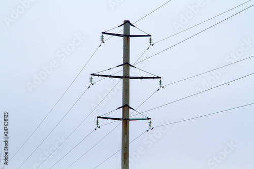 Towers of high voltage transmission lines in the winter