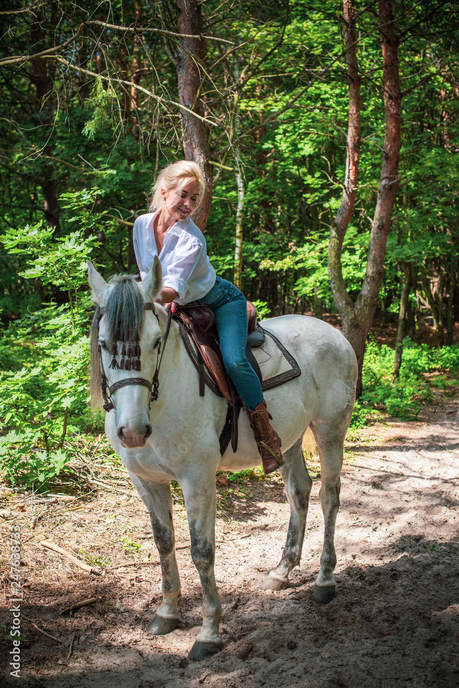 Spring - summer season, concept of hobby, Woman with a horse on a nature, relationship human and animals Spring - summer season, concept of hobby, Woman with a horse on a nature, relationship human and animals