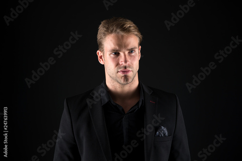 Man handsome well groomed macho on black background. Feeling confident. Male beauty and masculinity. Guy attractive confident model. Confident in his style. Man in dark clothes. Casually handsome