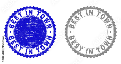 Grunge BEST IN TOWN stamp seals isolated on a white background. Rosette seals with grunge texture in blue and grey colors. Vector rubber watermark of BEST IN TOWN tag inside round rosette.