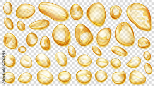 Set of yellow translucent water drops of different shapes, isolated on transparent background. Transparency only in vector format