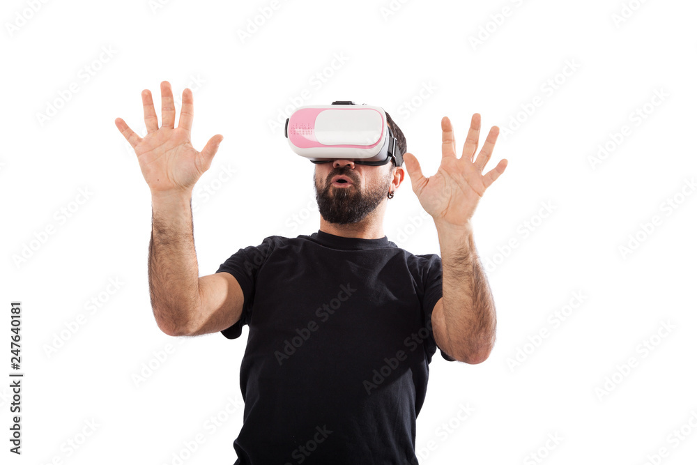 Bearded man use virtual reality glasses, goggles. Isolated. Guy in VR headset is looking at interactive screen. Playing mobile game app on device. Bearded man use virtual reality glasses, goggles. Isolated. Guy in VR headset is looking at interactive screen. Playing mobile game app on device.