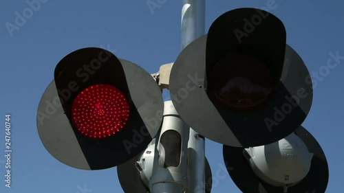 Red lights flash on railroad crossing