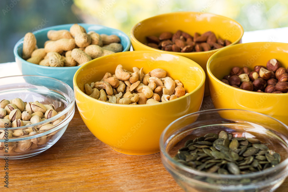 Mixed nuts on wood background 