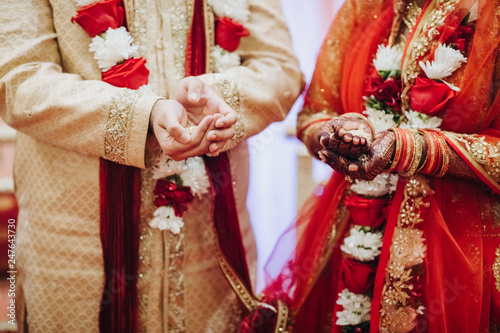 Ritual with coconut leaves during traditional Hindu wedding ceremony