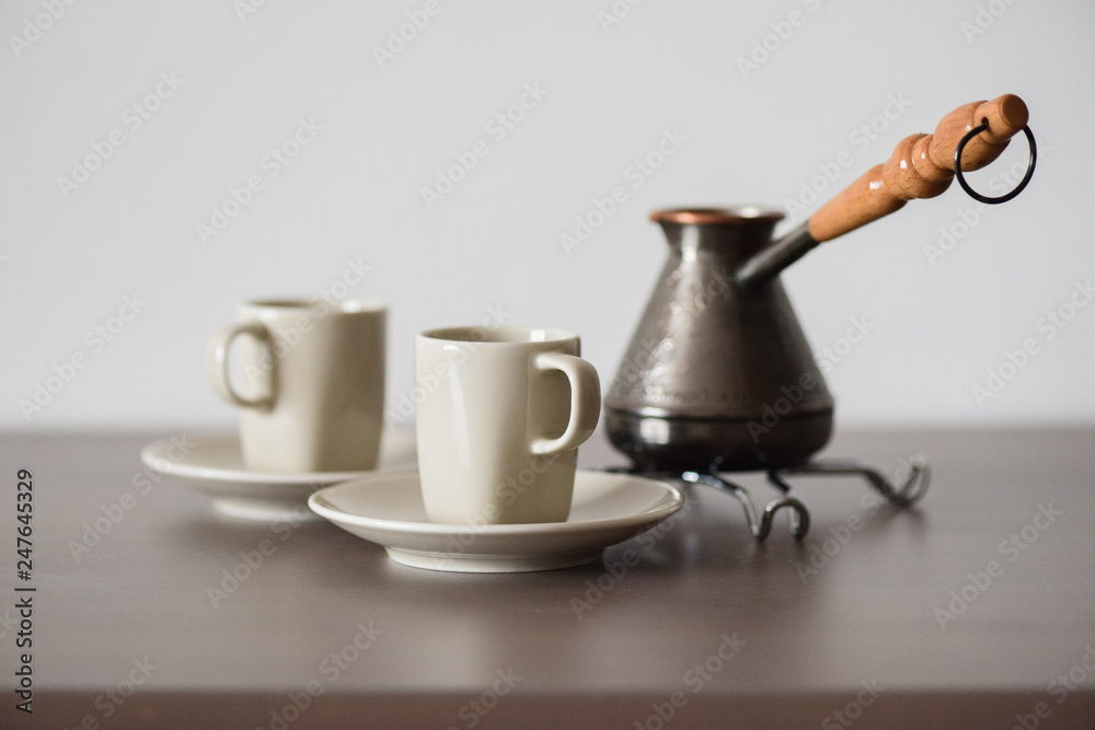 Traditional Turkish coffee brewed in coffee pot minimalist style