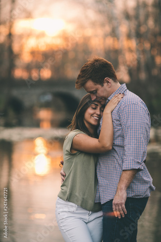 Young couple hugging at sunset 