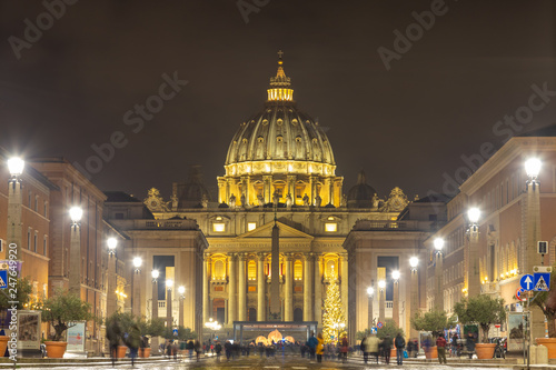 ROME / ITALY - DECEMBER 23, 2018: The magnificent evening view of St. Peter's Basilica in Rome by the Via della Conciliazione
