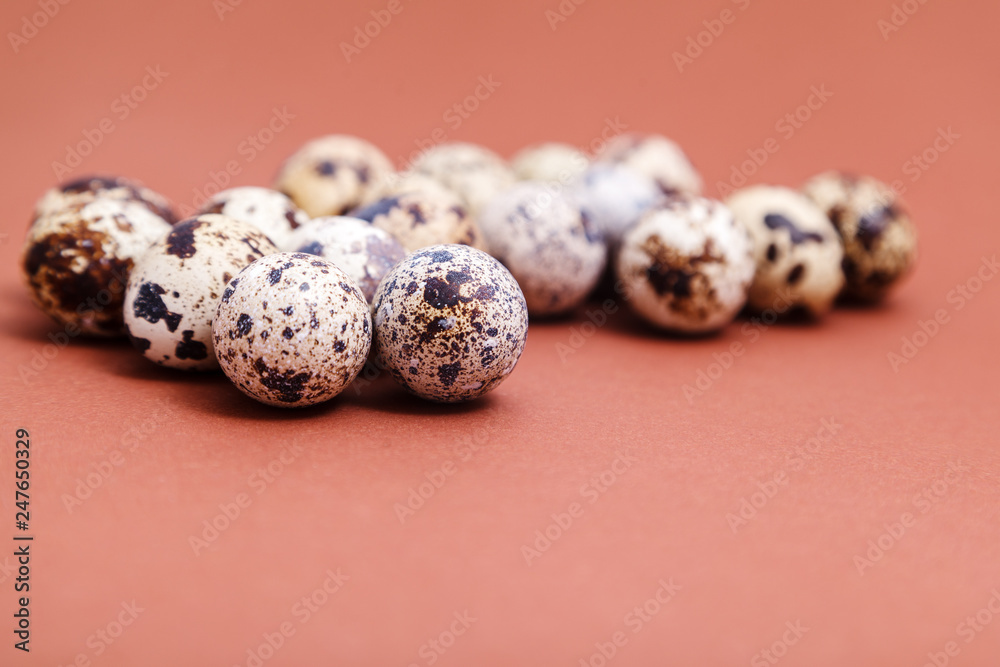 Quail eggs on a brown background, selective focus, copy space. Healthy food, nature concept. Festive Easter background Quail eggs on a brown background, selective focus, copy space. Healthy food, nature concept. Festive Easter background