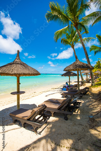 Trou aux biches  Mauritius. Tropical exotic beach with palms trees and clear blue water.