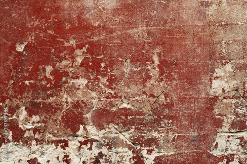 Background. Antique surface with cracks, potholes and stains of red paint. Daylight shooting