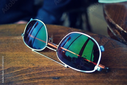 Sun Glasses Sitting on a Table with reflection © JMP Traveler