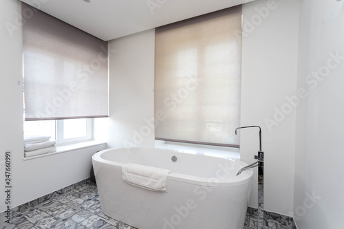 View of a Modern bathroom with white ceramic bath tub