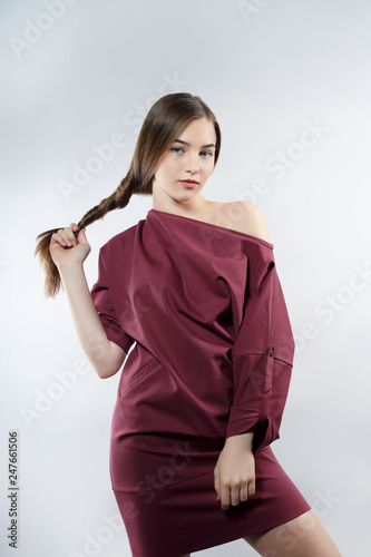 attractive long haired girl posing in Studio