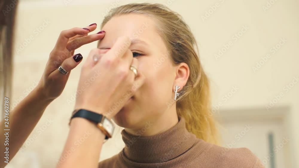 Permanent makeup. Permanent tattooing of eyebrows. Cosmetologist applying permanent make up on eyebrows- eyebrow tattoo. Permanent makeup. Permanent tattooing of eyebrows. Cosmetologist applying permanent make up on eyebrows- eyebrow tattoo.