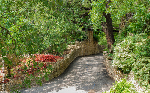Garden path lined with stones and flowers