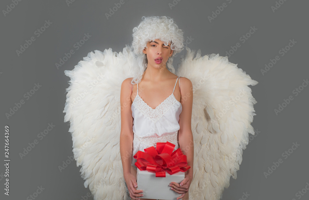 Cupid woman. Valentines day and costumes concept. Young woman in angel  costume. Angel with gift. Fallen white angel. Stock-foto | Adobe Stock