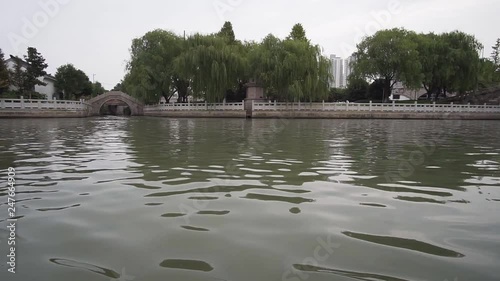 Low angle view of traveling down Suzhou river on boat in China photo