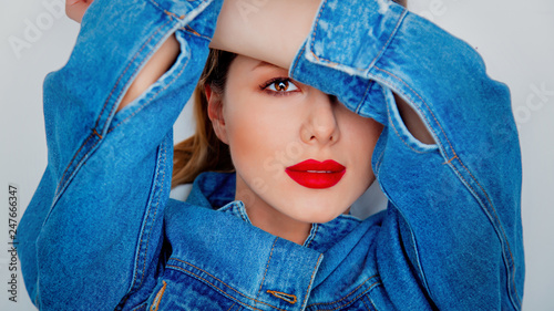 Closeup portrait of a beautiful woman in blue jeans