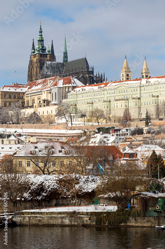 Snowy Prague Lesser Town with Prague Castle above River Vltava, Czech republic