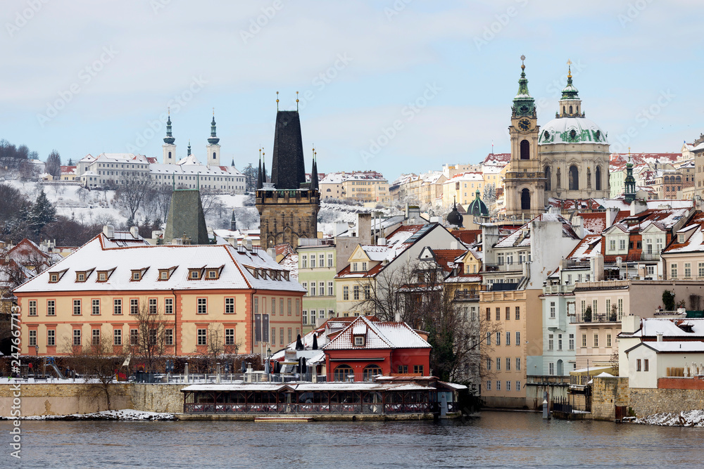 Snowy Prague Lesser Town with St. Nicholas' Cathedral, Czech republic