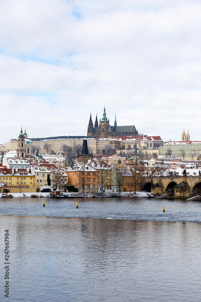 Obraz premium Snowy Prague Lesser Town with Prague Castle and Charles Bridge, Czech republic