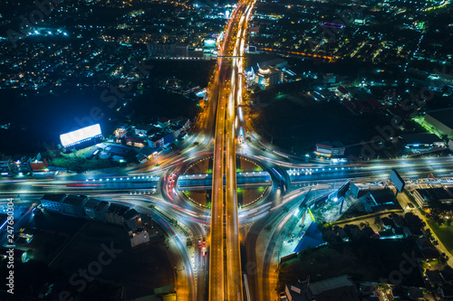 long exposure at night  cityscape and ring road with freeway traffic car transportation in Thailand aerial top view