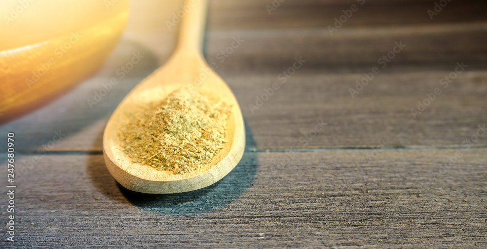 Spoon with Kava Kava root powder in wooden cup - obrazy, fototapety, plakaty 