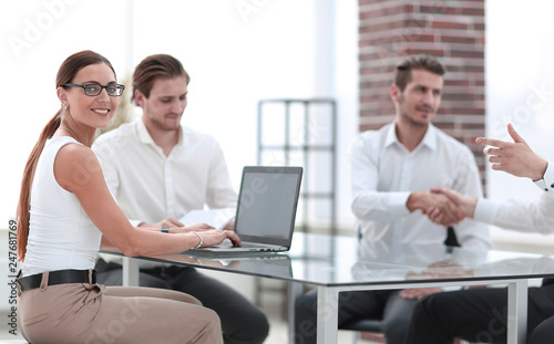 business people make a deal in the office.