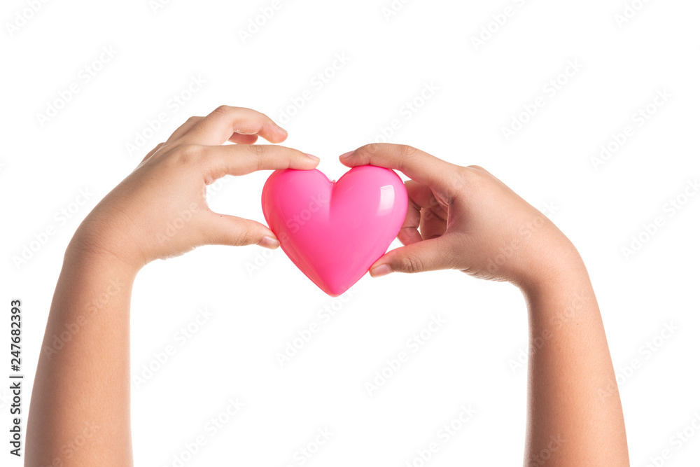 Pink heart on kid hand isolated on white