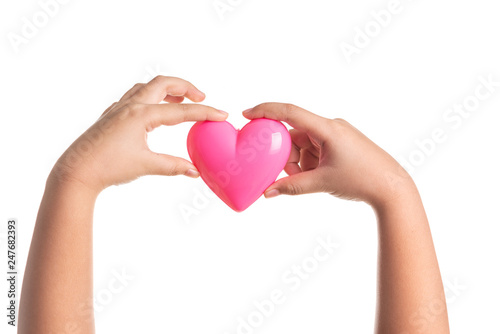 Pink heart on kid hand isolated on white