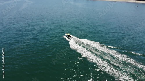 aerial circle around boat photo