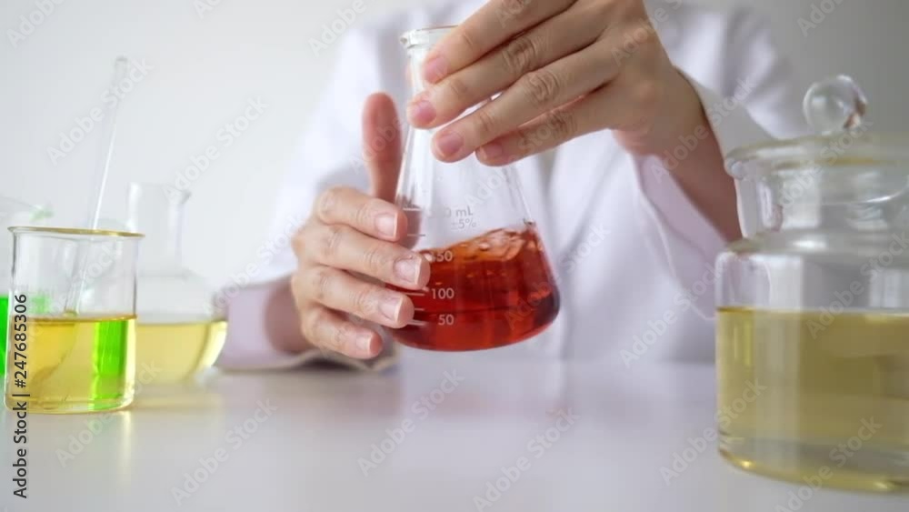 scientist chemist pharmacist work in the laboratory experiment extract natural red ingredient for health care innovation medicine and cosmetic ,beauty product, skincare. scientist chemist pharmacist work in the laboratory experiment extract natural red ingredient for health care innovation medicine and cosmetic ,beauty product, skincare.