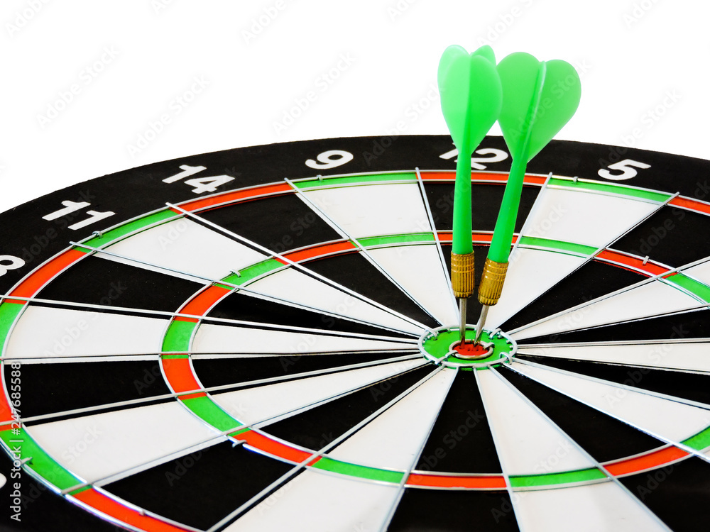 Dart arrow hitting in the target center of dartboard. Success hitting target aim goal achievement concept background.Darts and dart board.Close up shot of the dart arrow.Marketing concept. Dartboard. Dart arrow hitting in the target center of dartboard. Success hitting target aim goal achievement concept background.Darts and dart board.Close up shot of the dart arrow.Marketing concept. Dartboard.