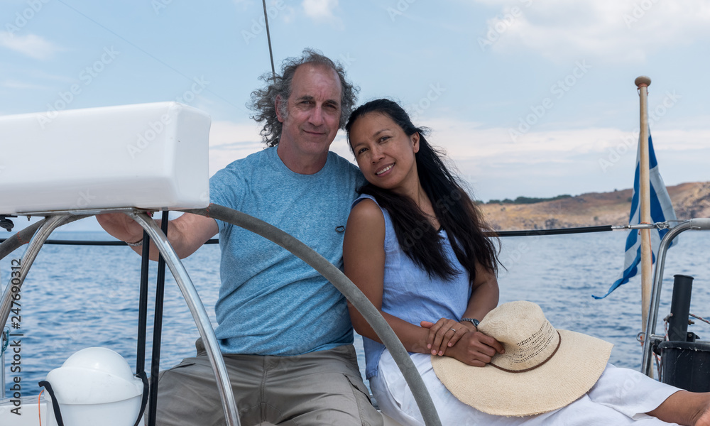 Man and woman in cockpit of sailboat