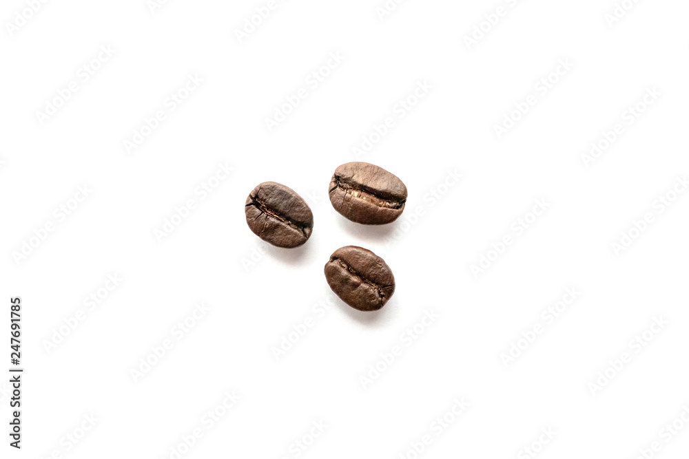 Coffee beans isolated on white background. Close-up. Coffee beans isolated on white background. Close-up.