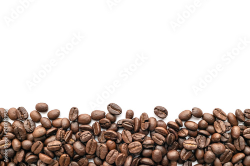 Roasted coffee beans on white background. Close-up.