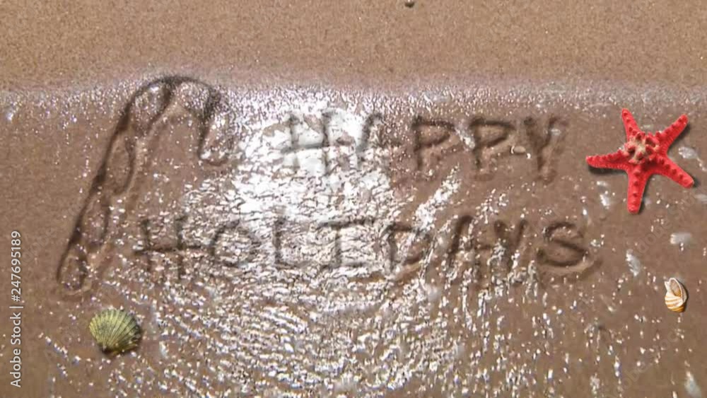 Happy Holidays at the Beach 4K features waves washing up on a sandy beach and leaving behind a Happy Holiday’s message written in the sand